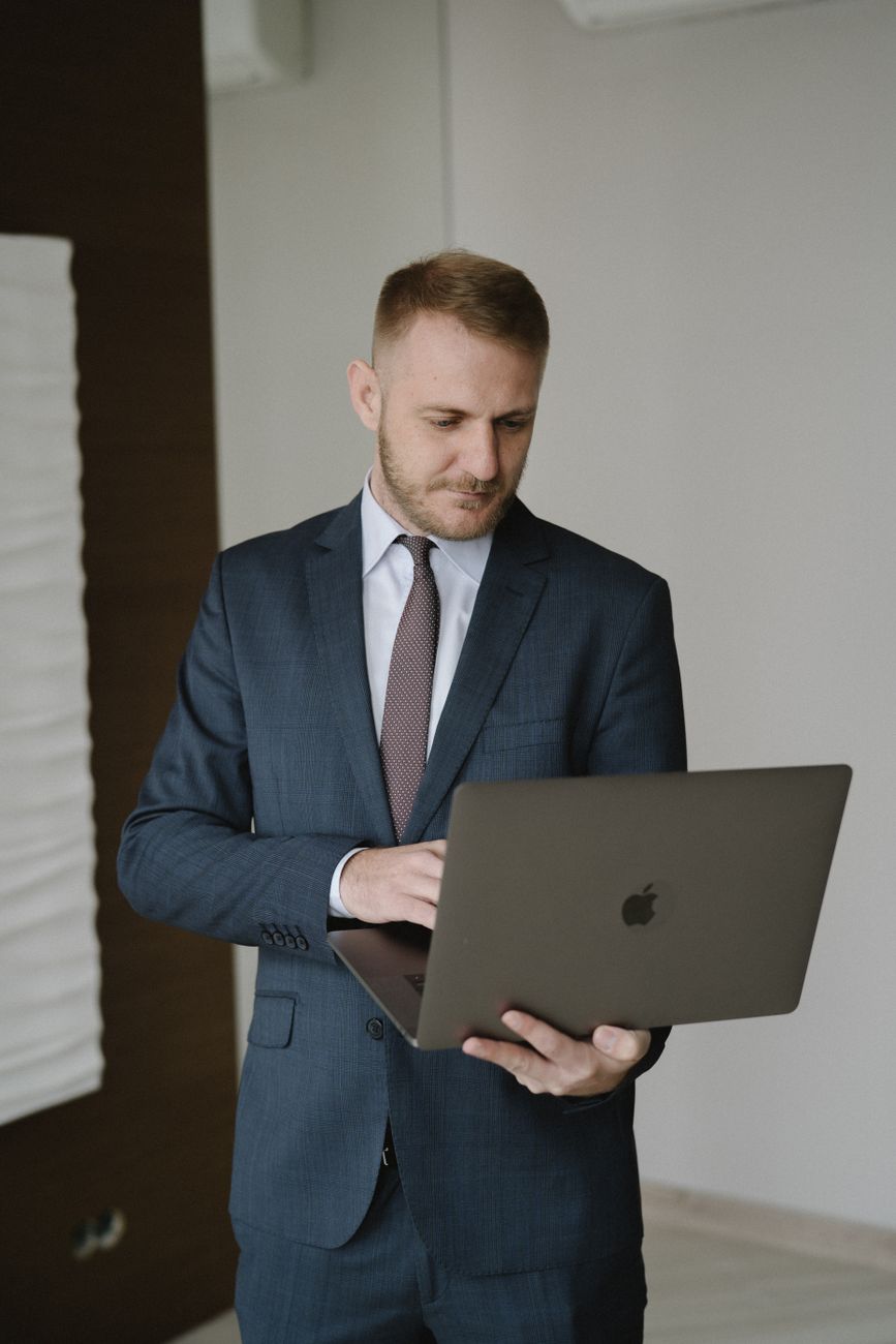 Business owner reviewing digital marketing job postings on a laptop