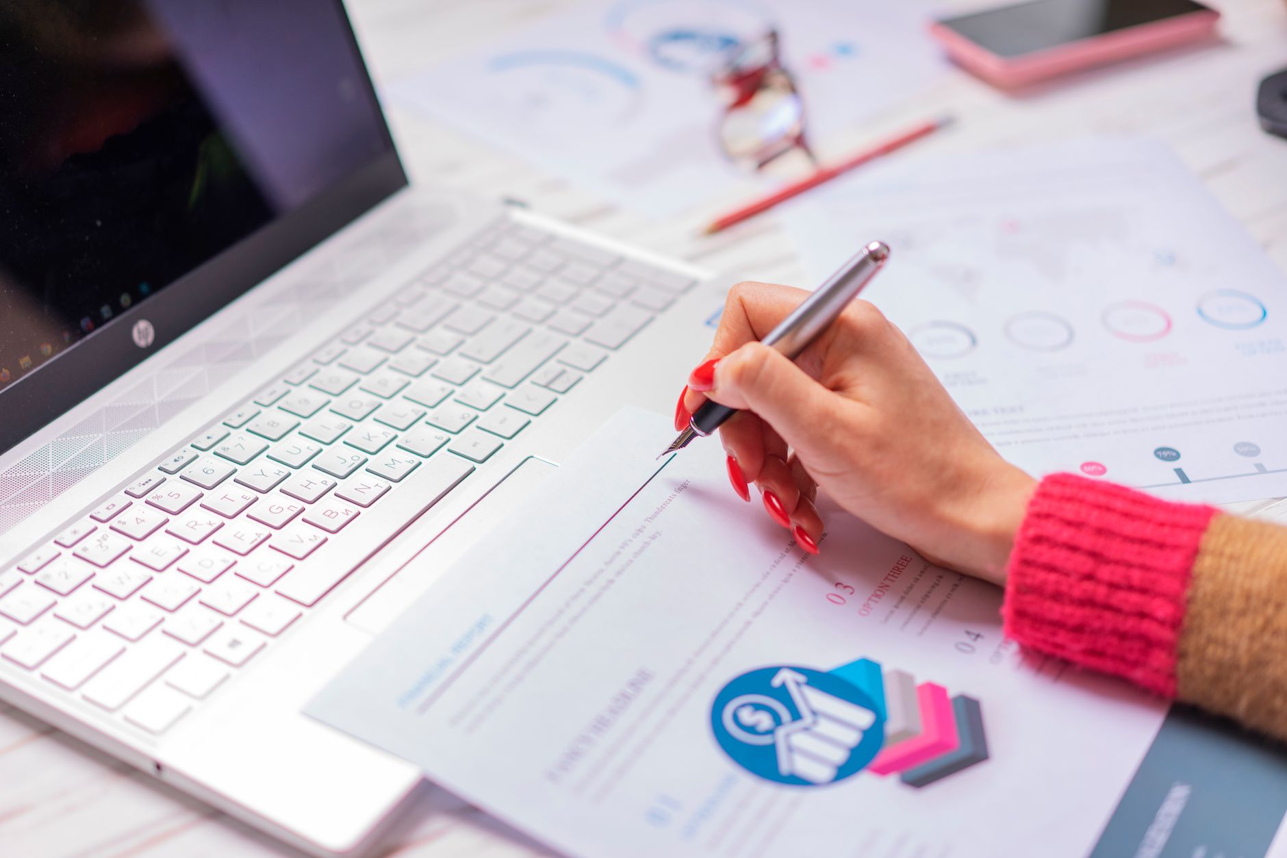 Marketer using AI writing tool on laptop