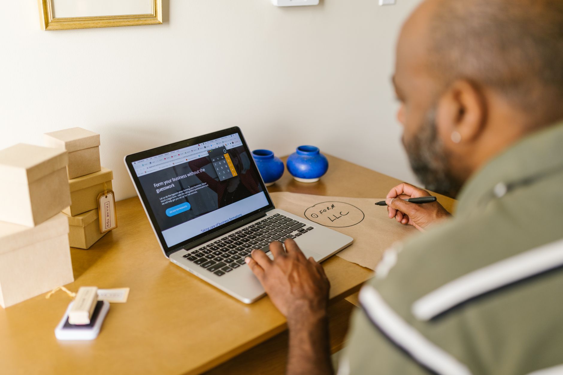 Local business owner researching digital marketing agencies on a laptop