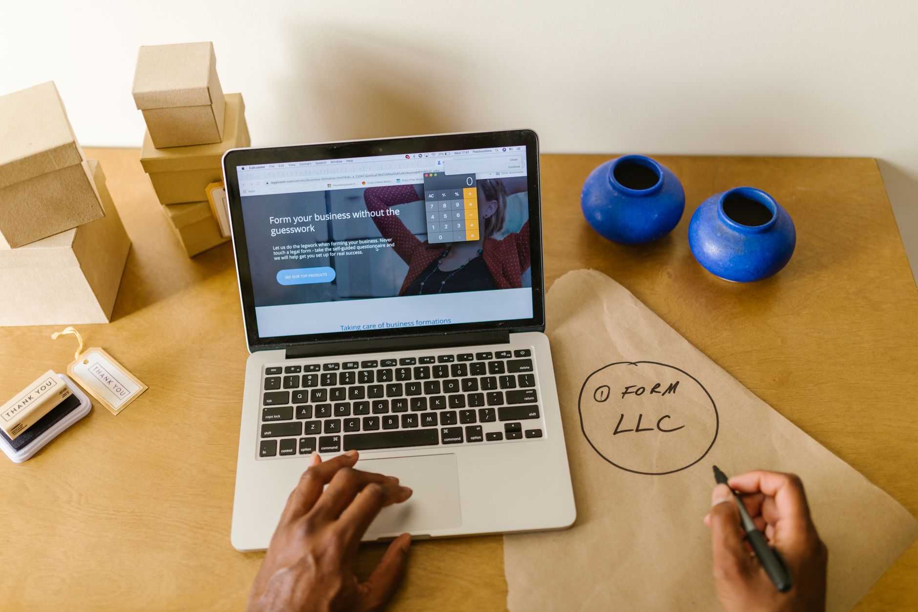 Small business owner reviewing digital marketing strategy on laptop