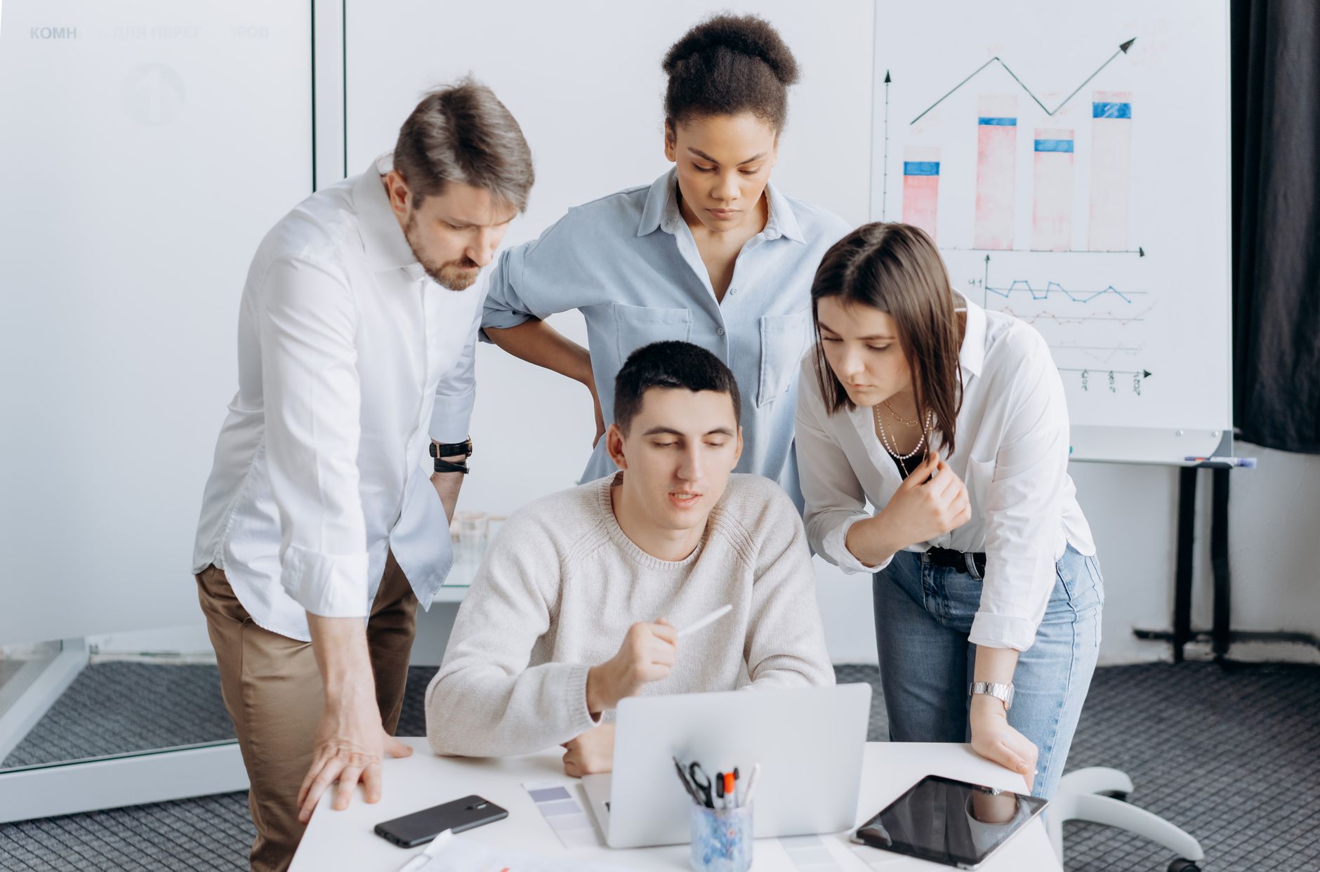 Developer and marketer collaborating on laptop reviewing website audit results