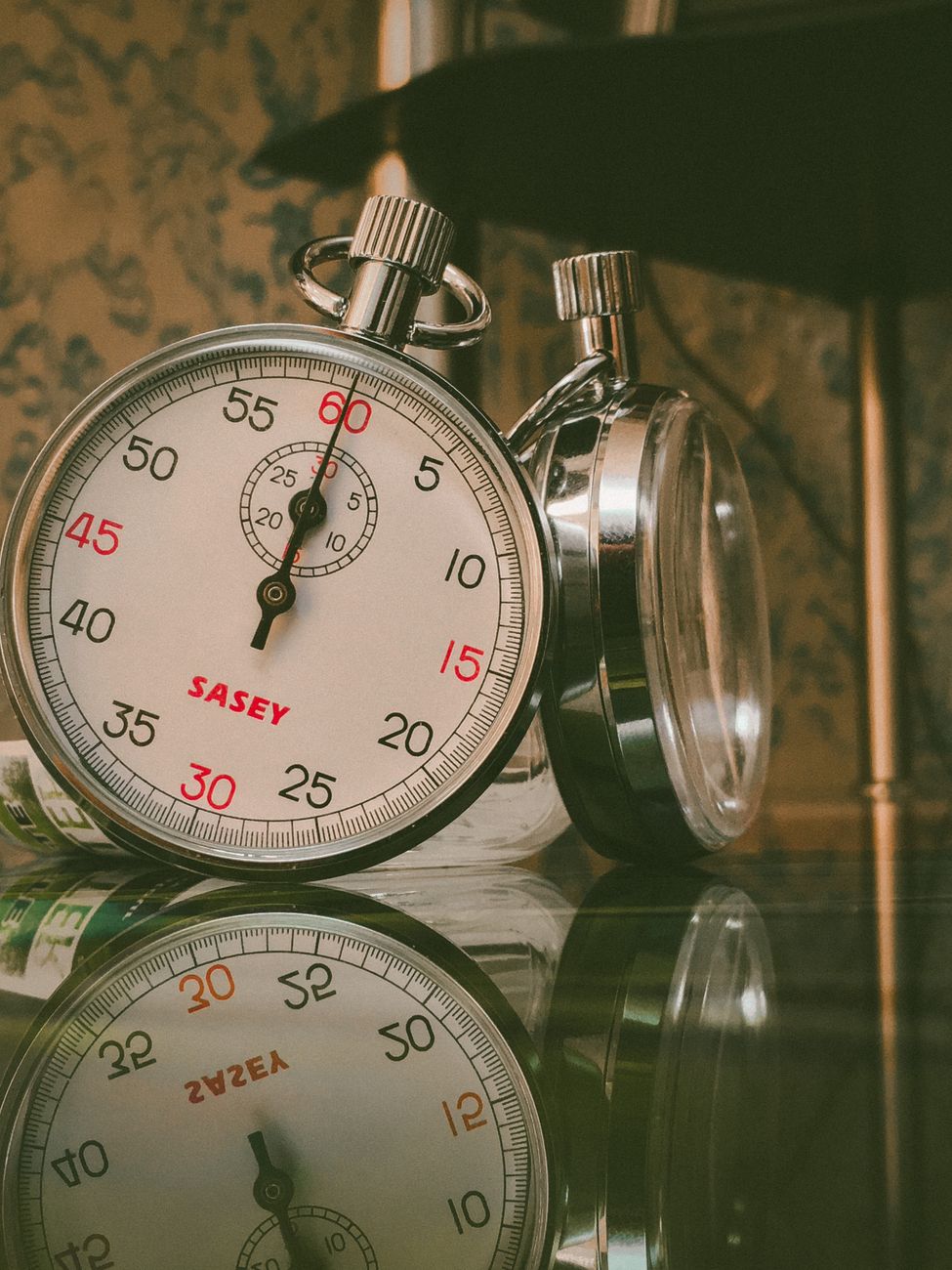 Stopwatch next to a browser window symbolizing page load speed