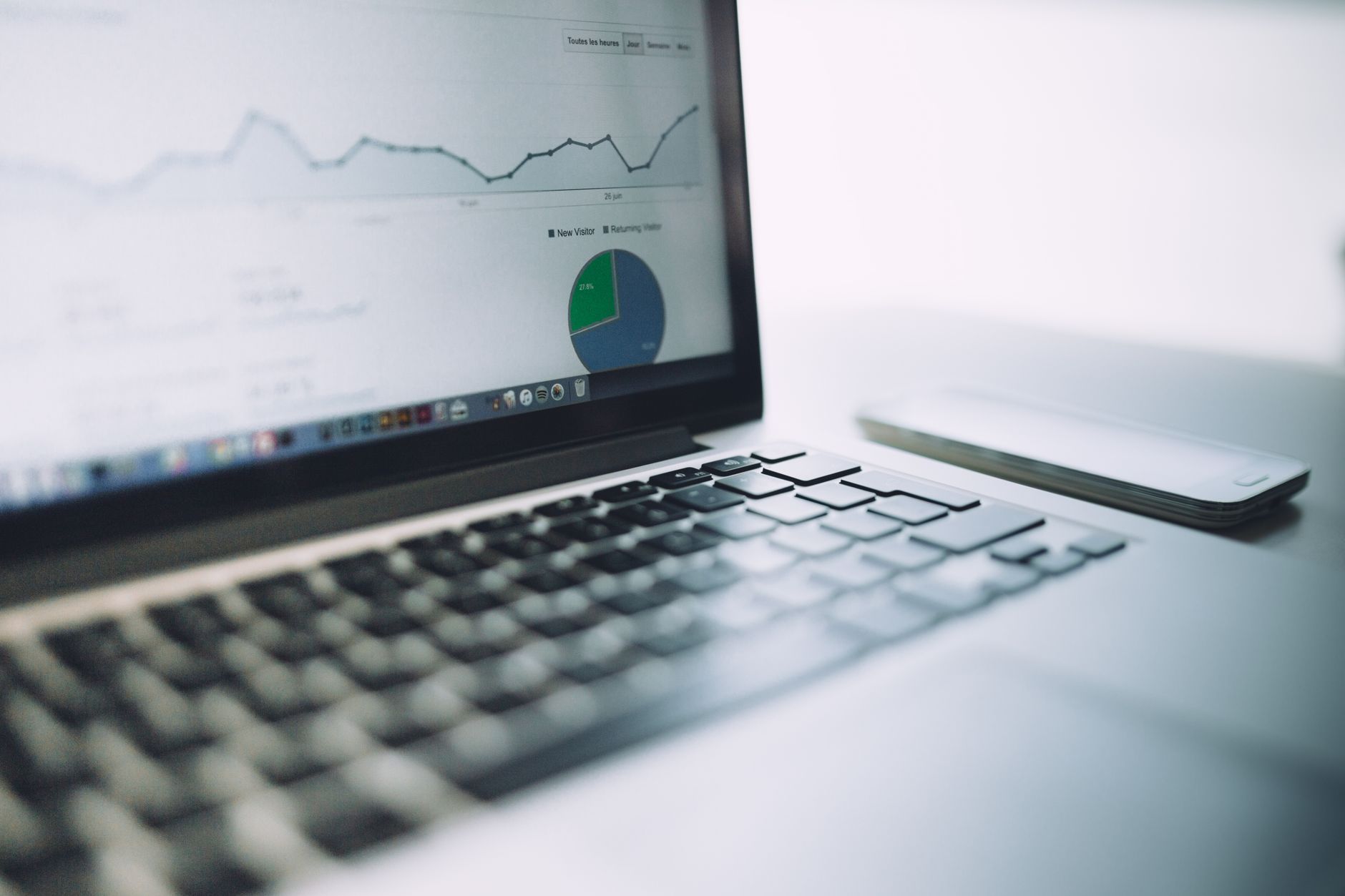 Person using laptop to analyze website SEO metrics on screen