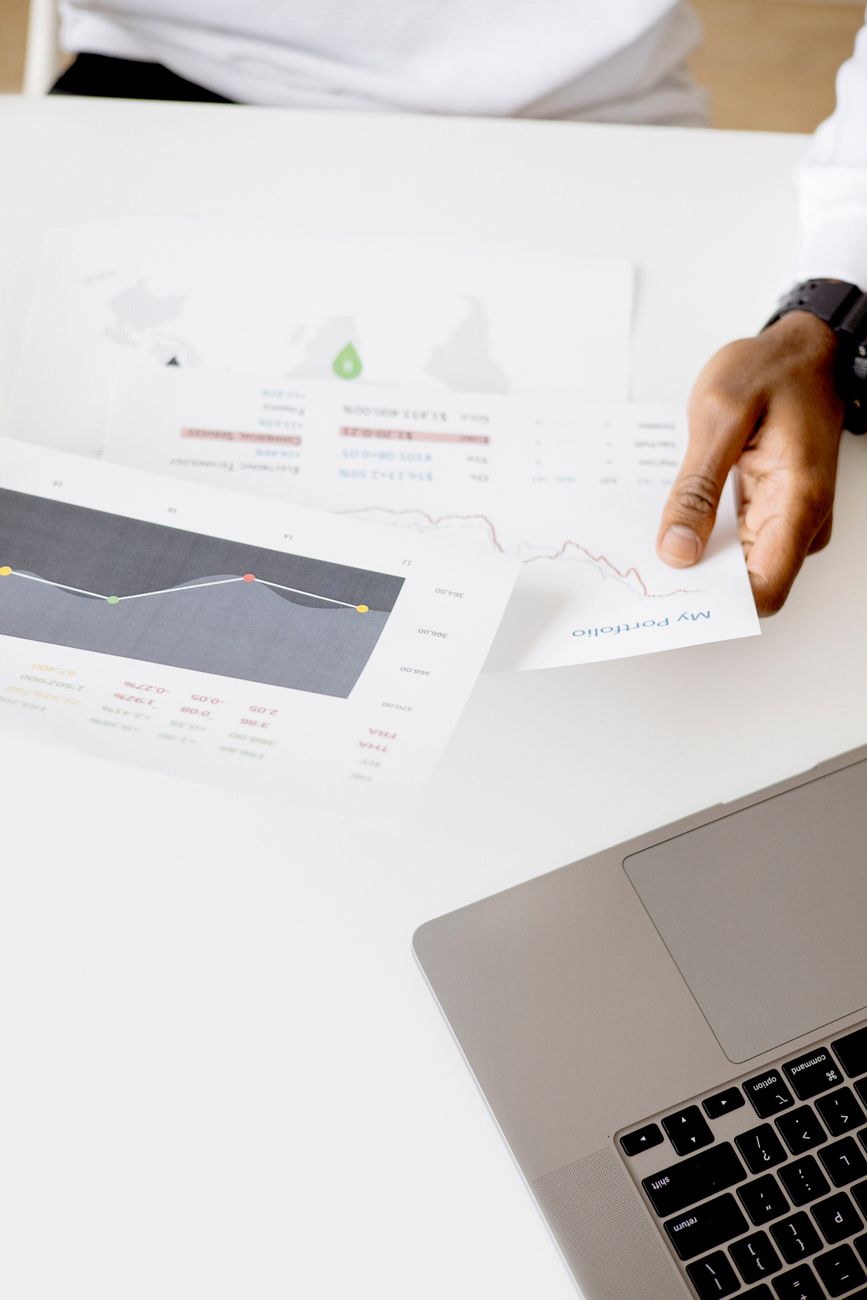 Person reviewing SEO audit results on a desktop monitor with actionable recommendations