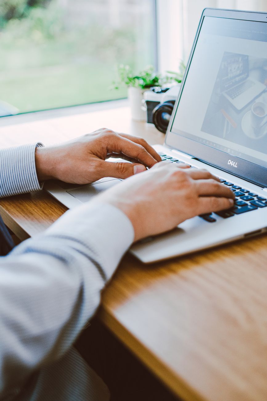 Person performing a DIY SEO audit on a laptop using free online tools