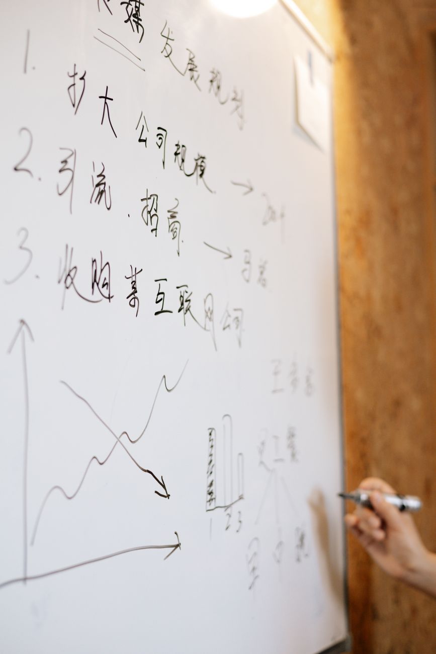 SEO professional creating a prioritized action plan on a whiteboard