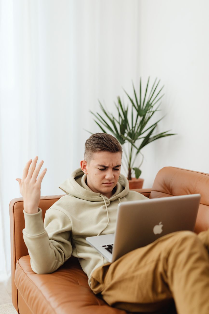 Person frustrated at laptop after being asked to sign up for SEO tool