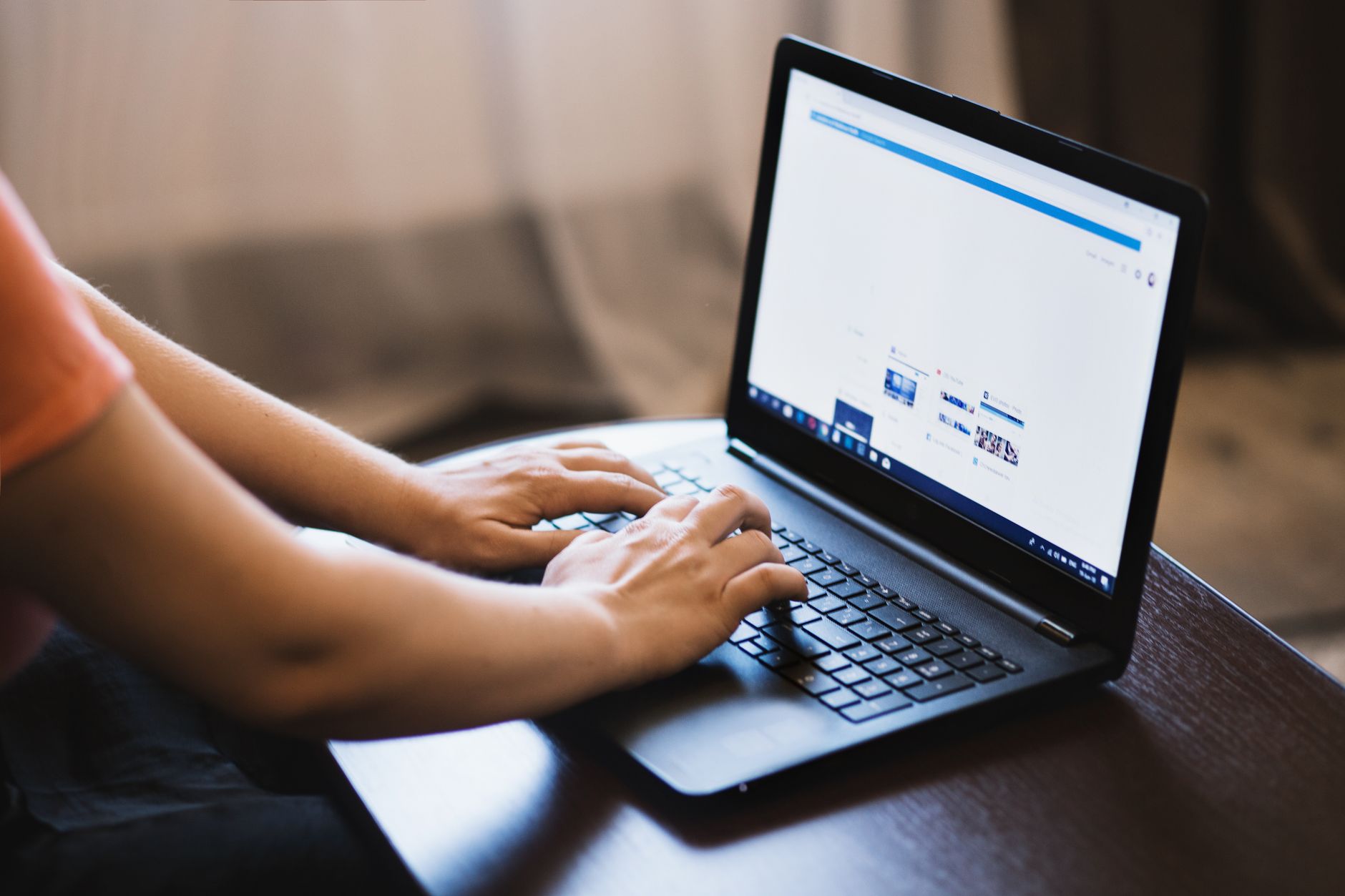 Freelancer building an SEO audit report on a laptop