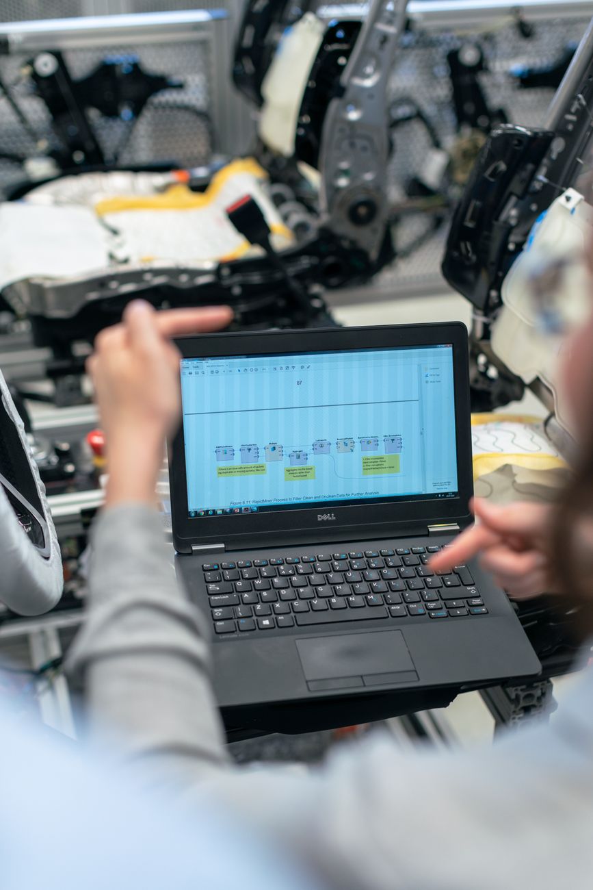 Web developer optimizing images on a laptop for faster page load speed