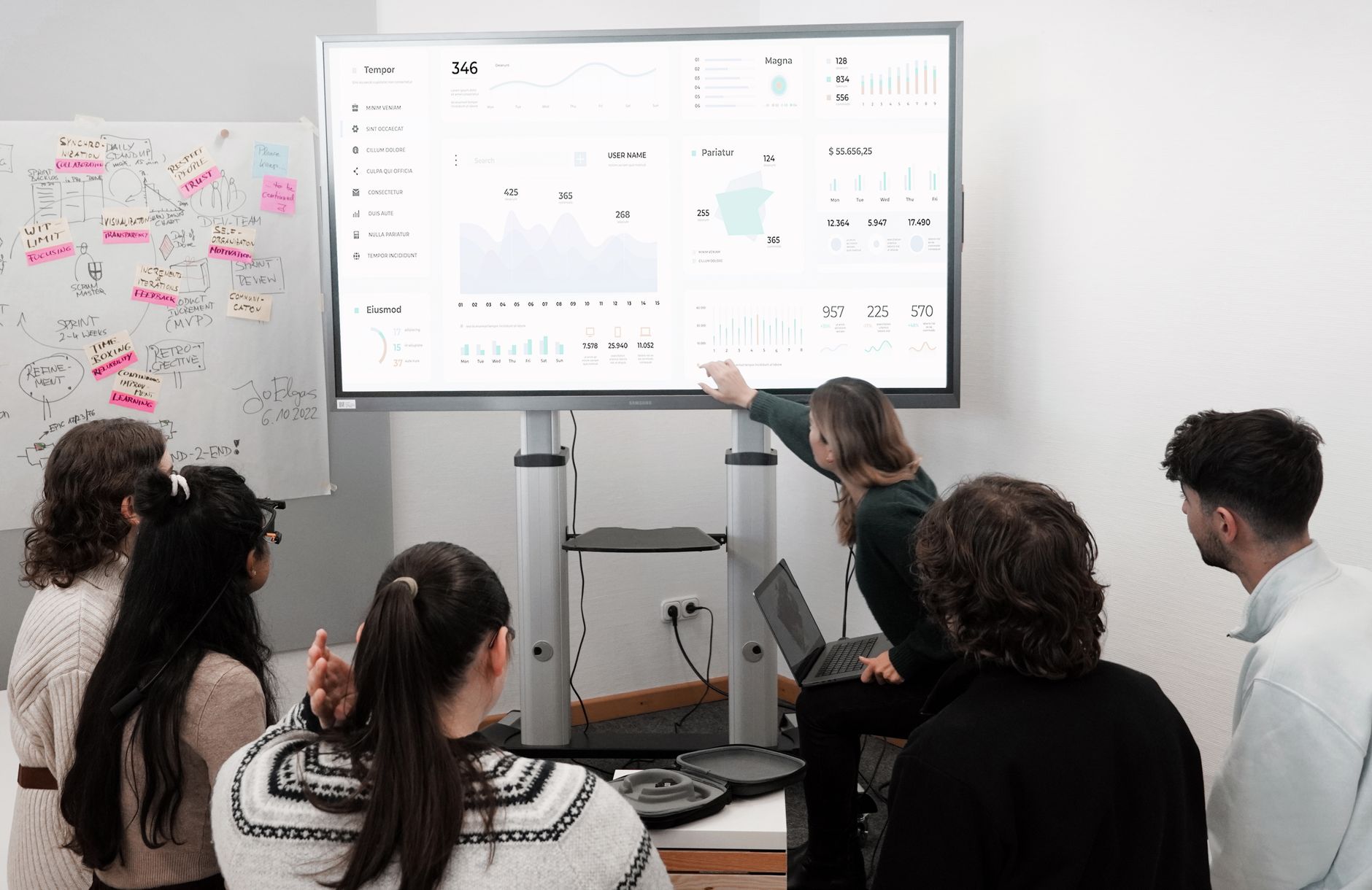 Developer and SEO strategist reviewing website performance dashboard on dual monitors