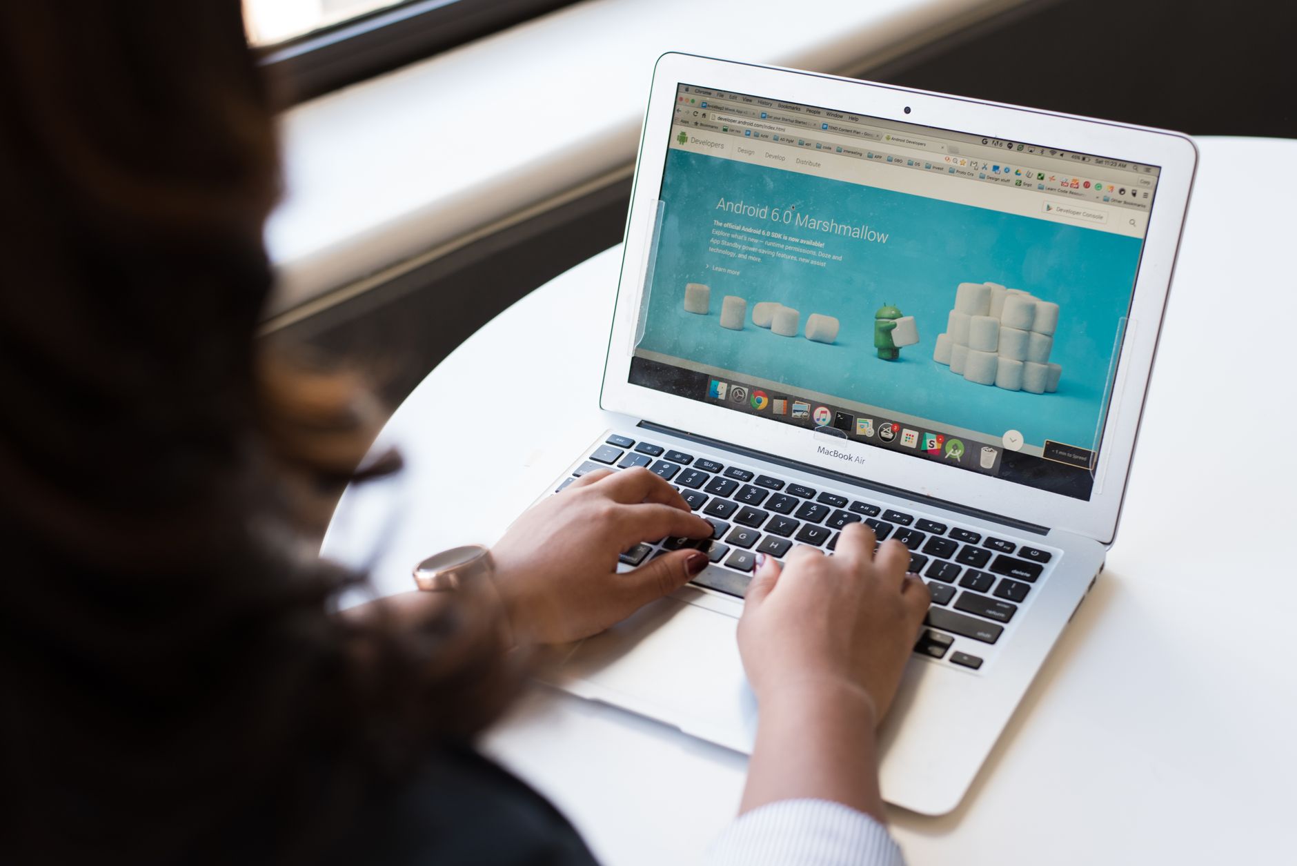Developer reviewing website optimization checklist on laptop with analytics dashboard