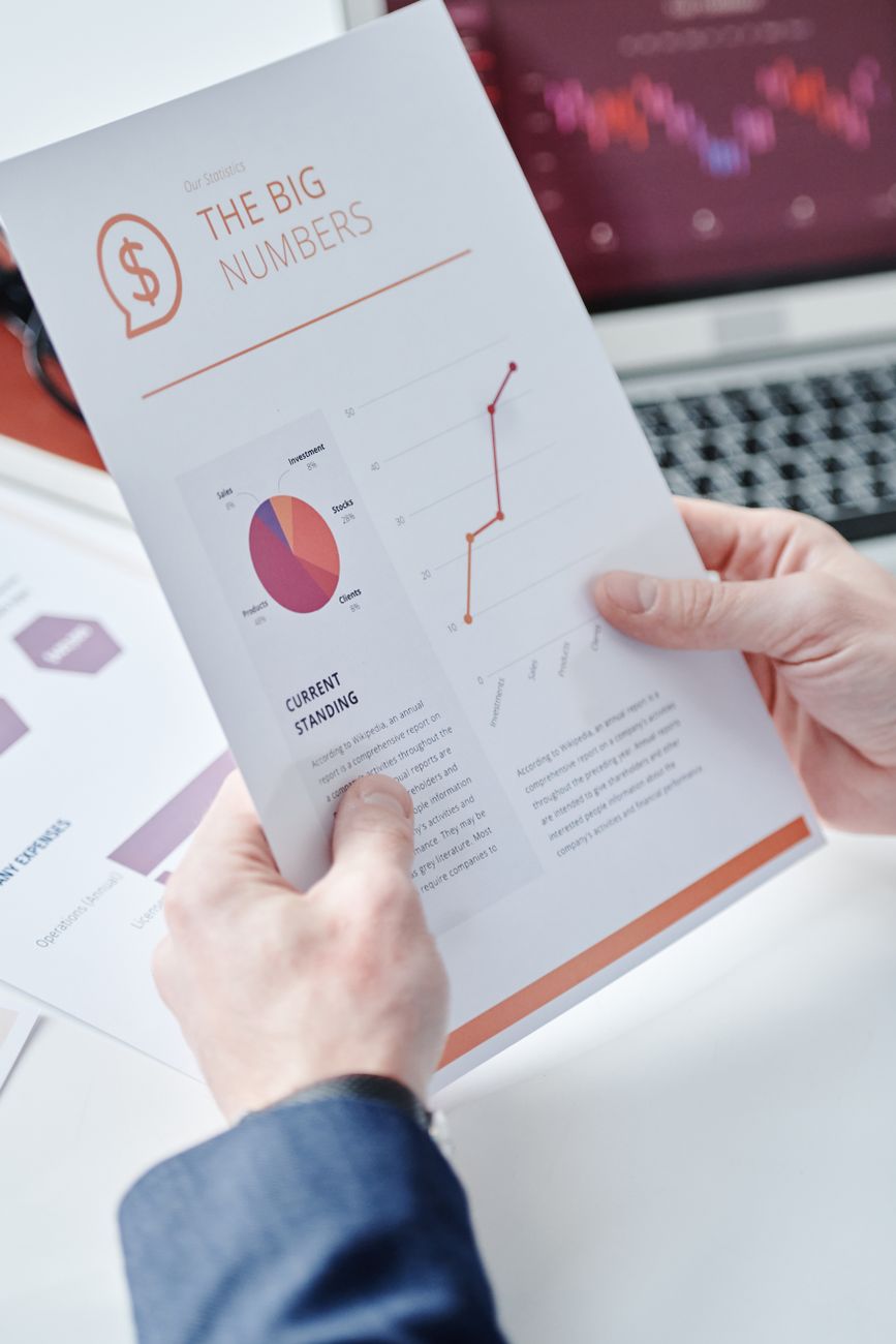 Person reviewing an SEO audit report PDF on a laptop with highlighted action items