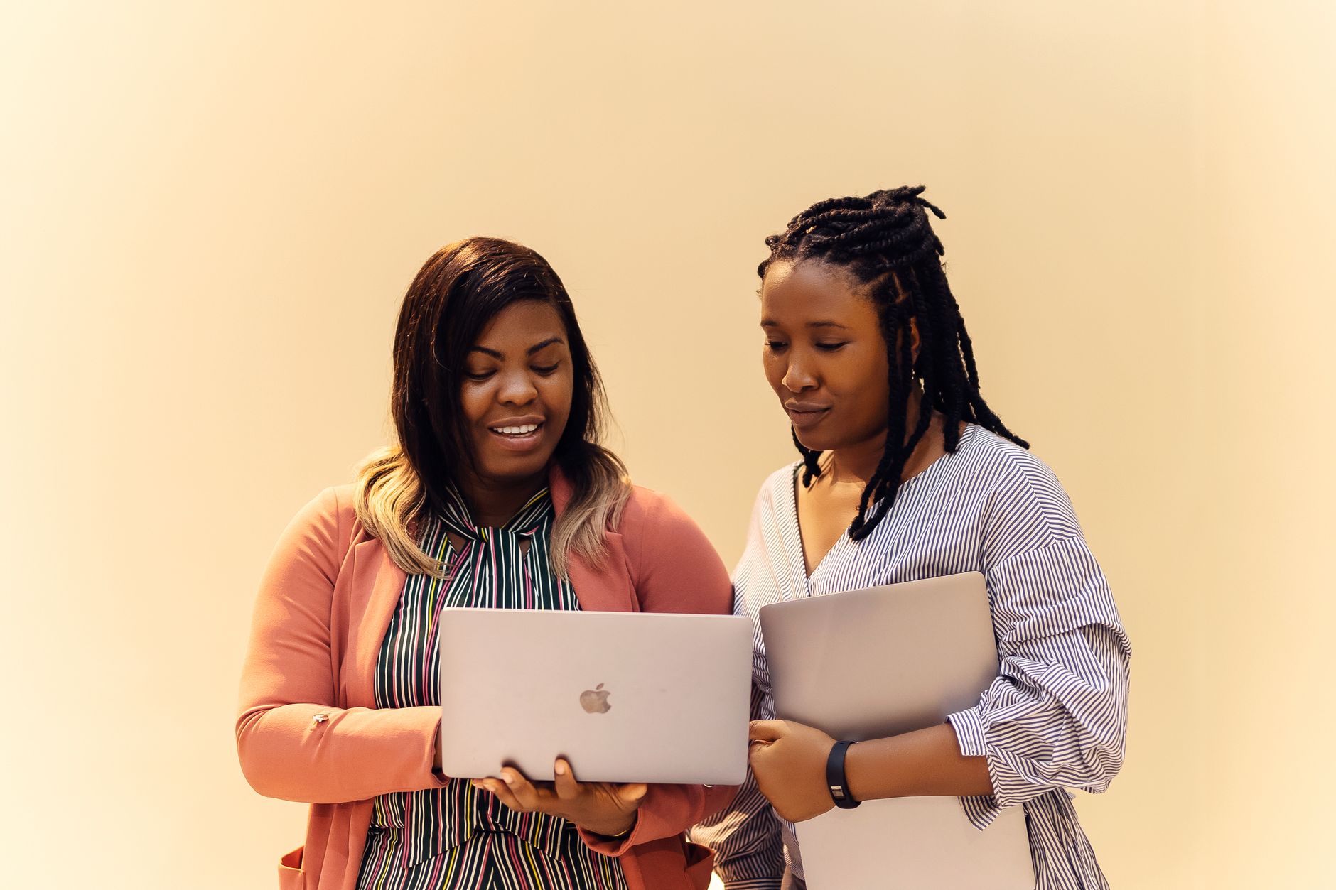 African entrepreneurs collaborating on digital business strategy with laptops