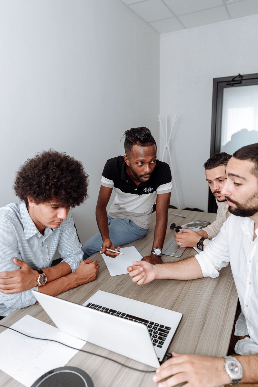 Group of young African entrepreneurs collaborating around a table