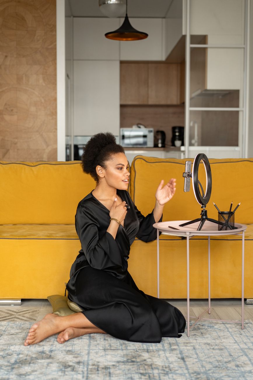 African content creator filming a video in a modern studio