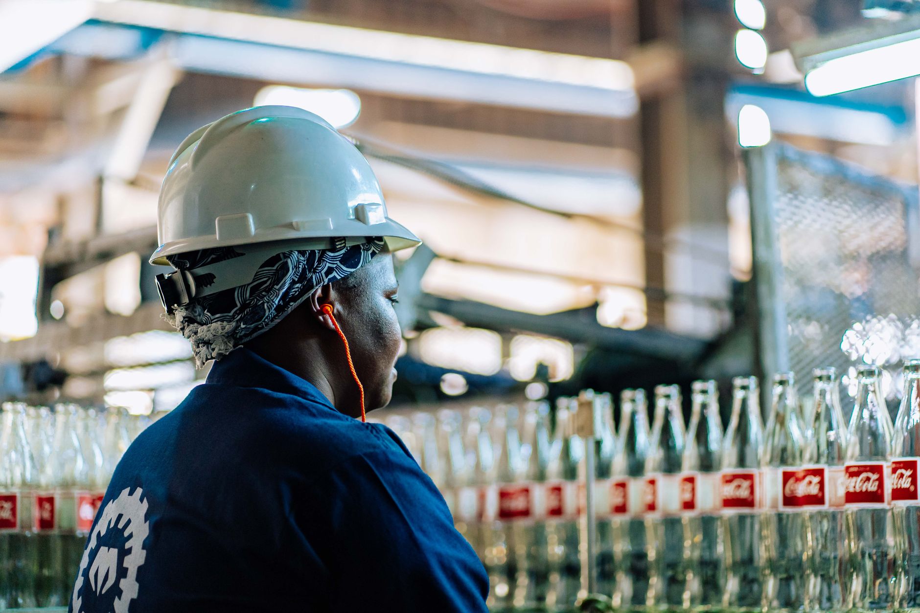 African agro-processing facility with workers packaging food products