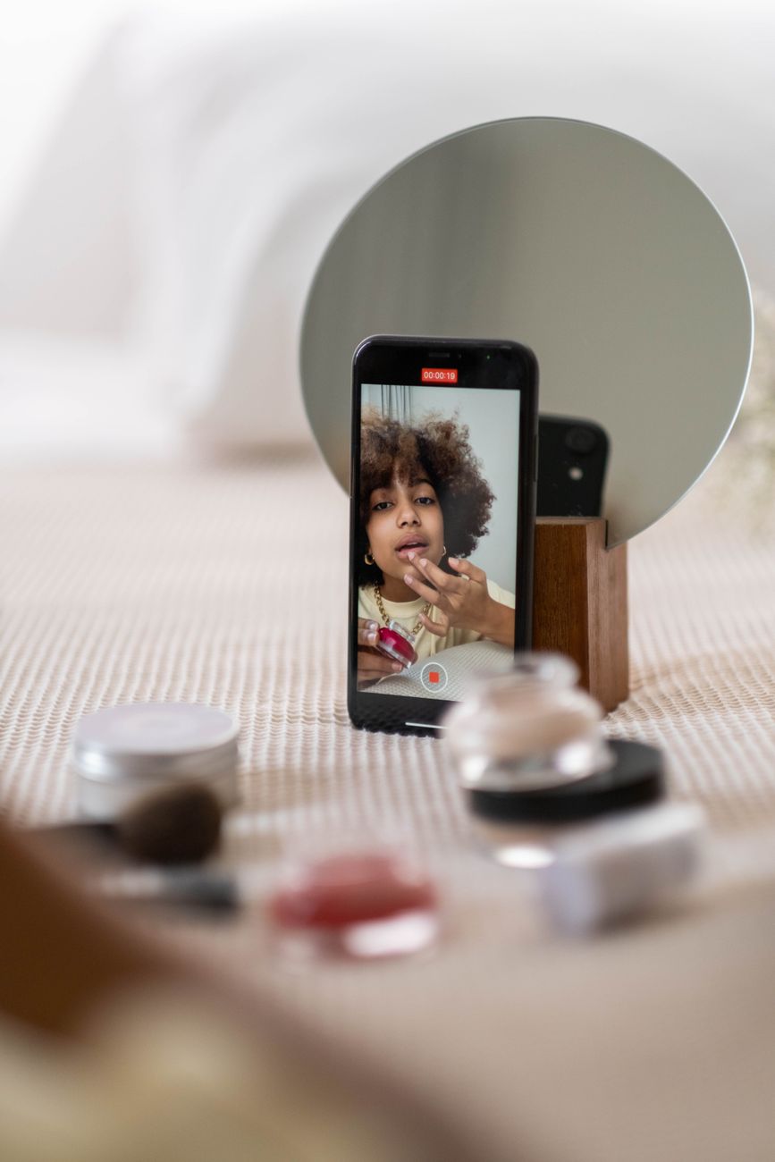 African influencer presenting a brand product on camera