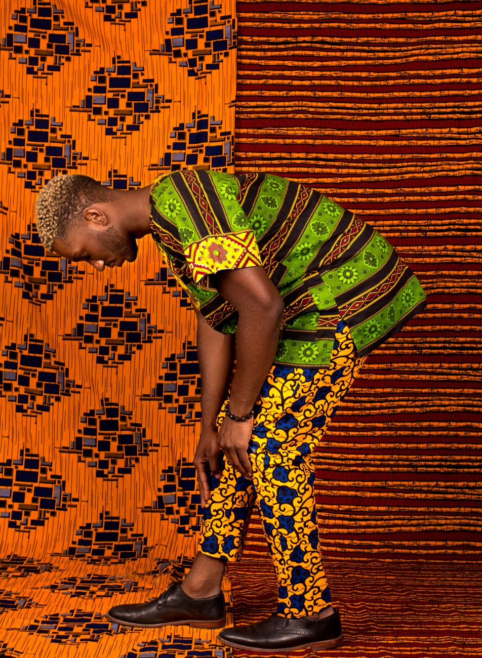 Colourful African print clothing and merchandise laid out on a table