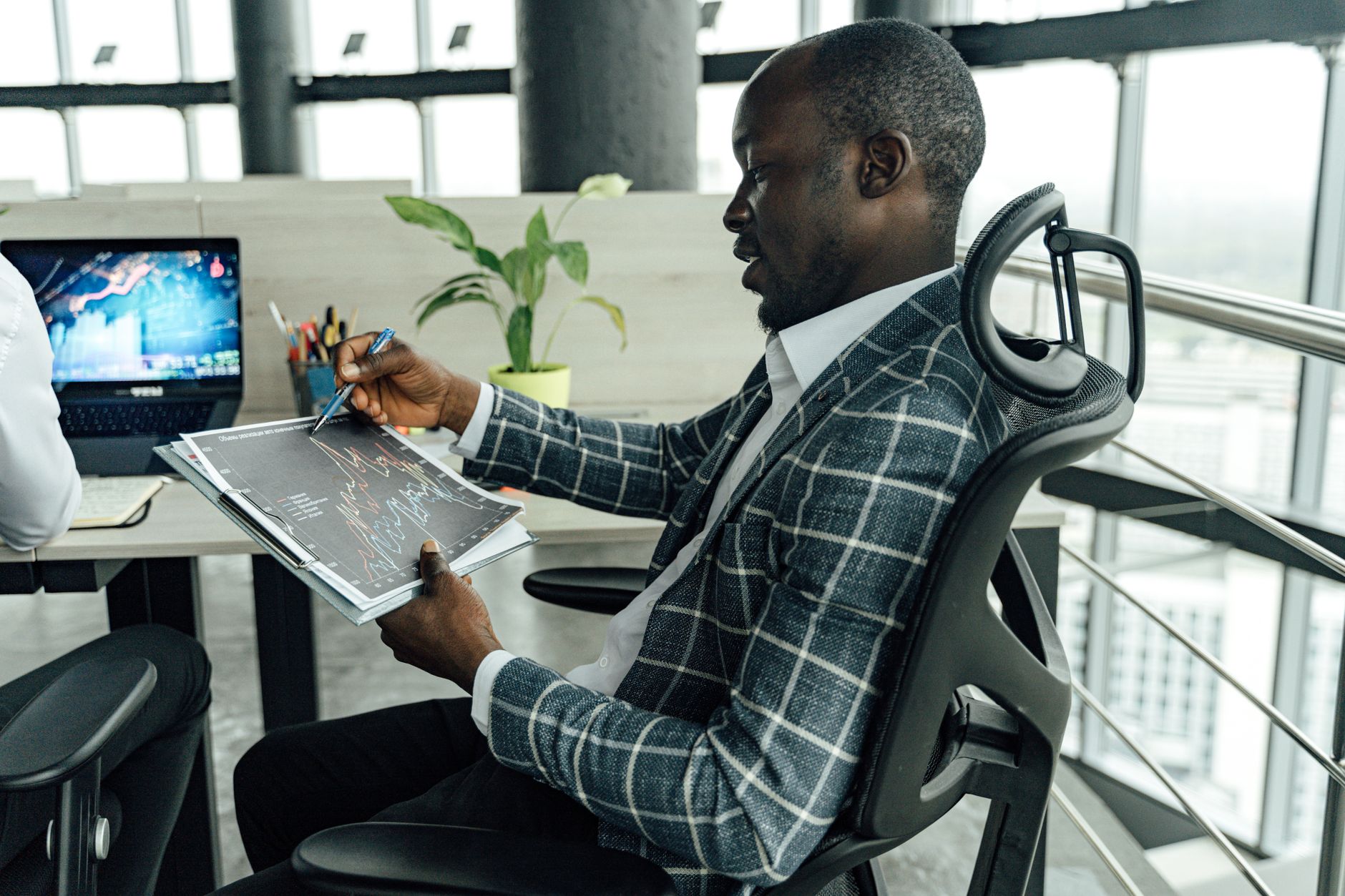 African diaspora investors in a business meeting reviewing investment portfolios