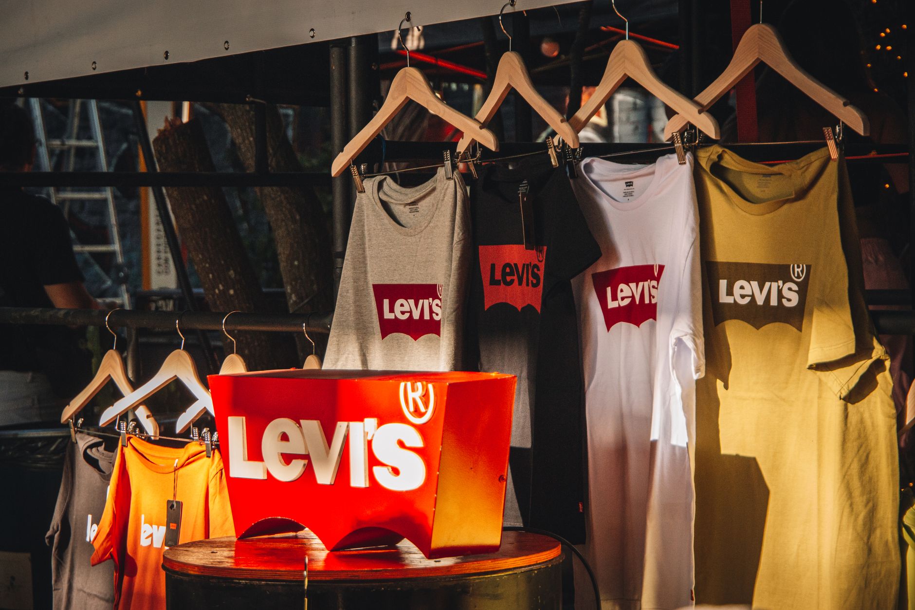 African creator displaying branded merchandise collection