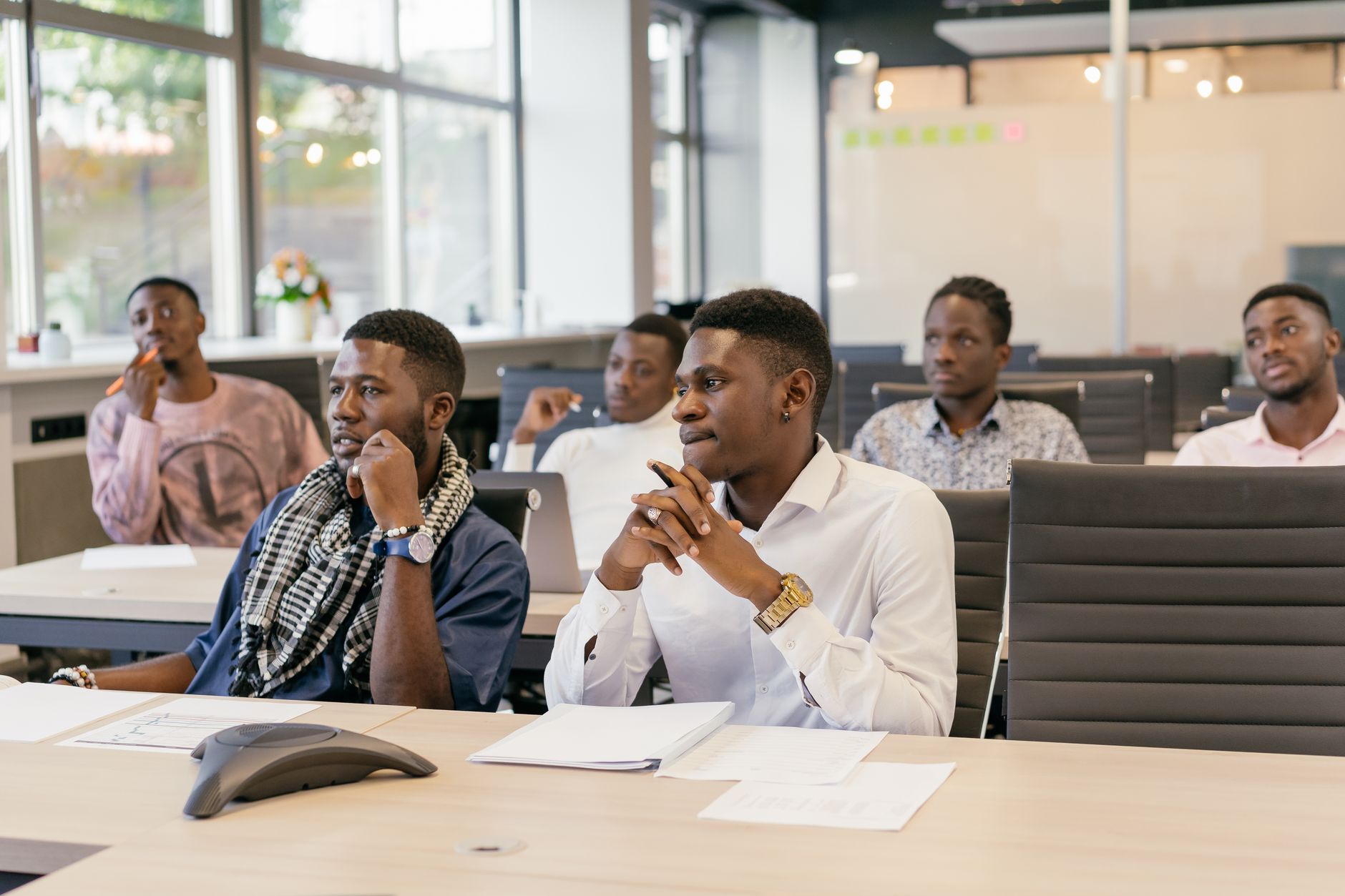 African content creators attending a conference workshop session