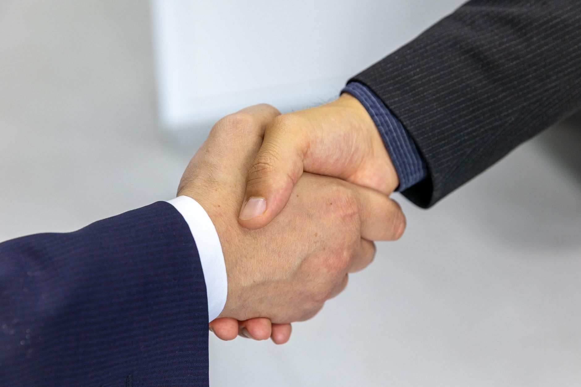 African creators shaking hands in business partnership meeting