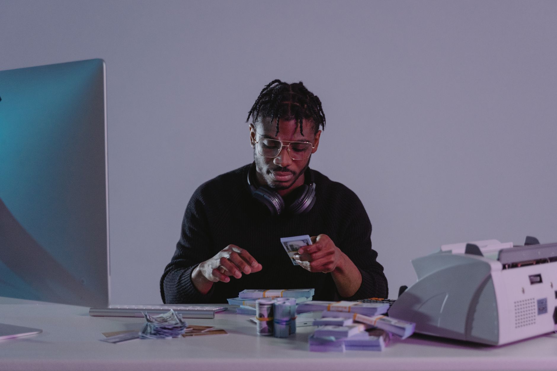African creator working on content monetization strategy at a desk