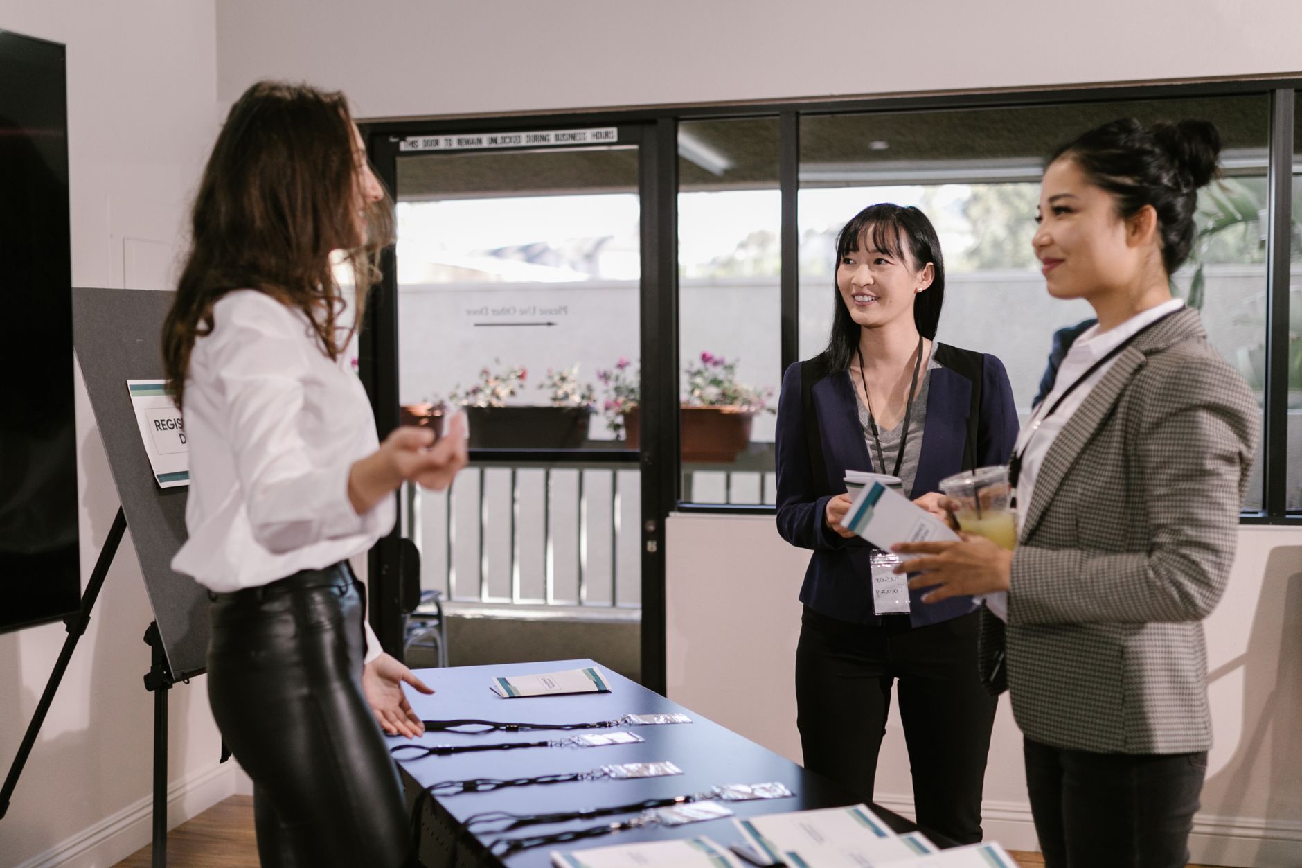 Professionals networking and exchanging business cards at a conference
