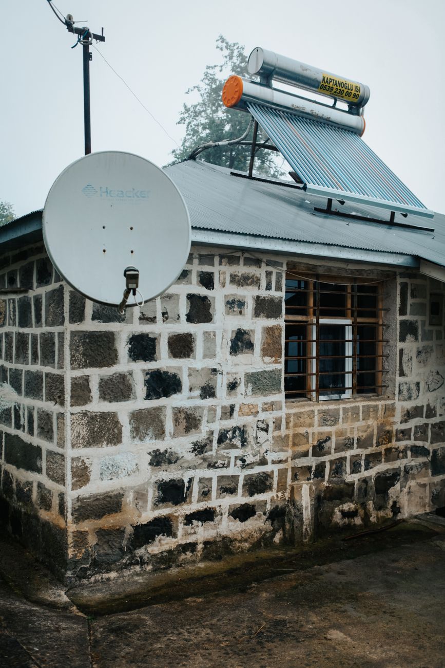 Solar panels installed on rooftops in an African village community