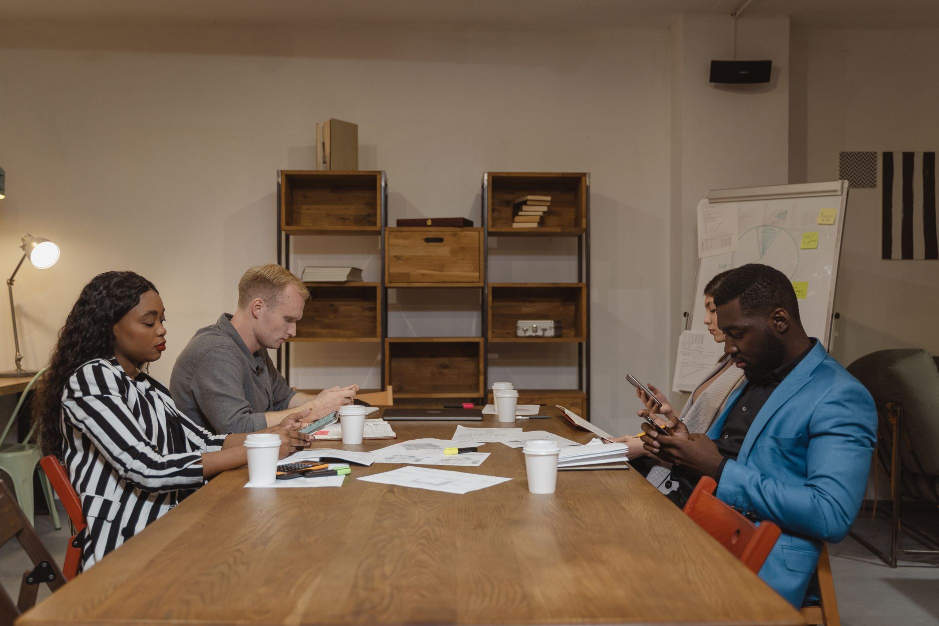 African entrepreneurs collaborating on innovation project in a modern co-working space