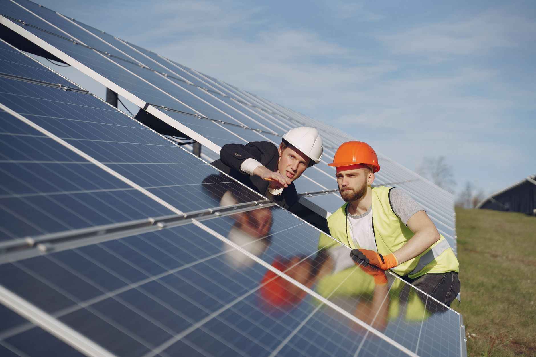 Young African innovator working on solar energy project outdoors