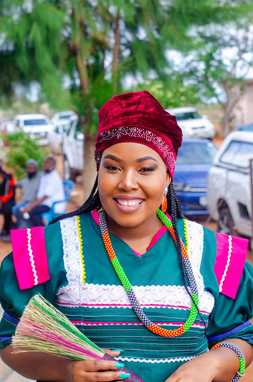 Ndebele woman wearing traditional beaded clothing and neck rings