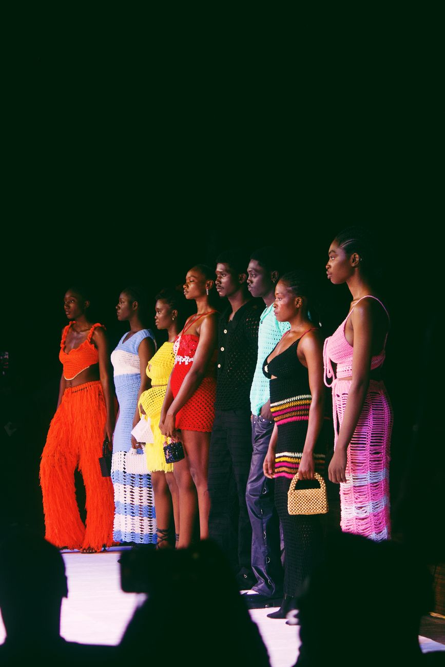Contemporary African fashion designer presenting a modern collection on a runway