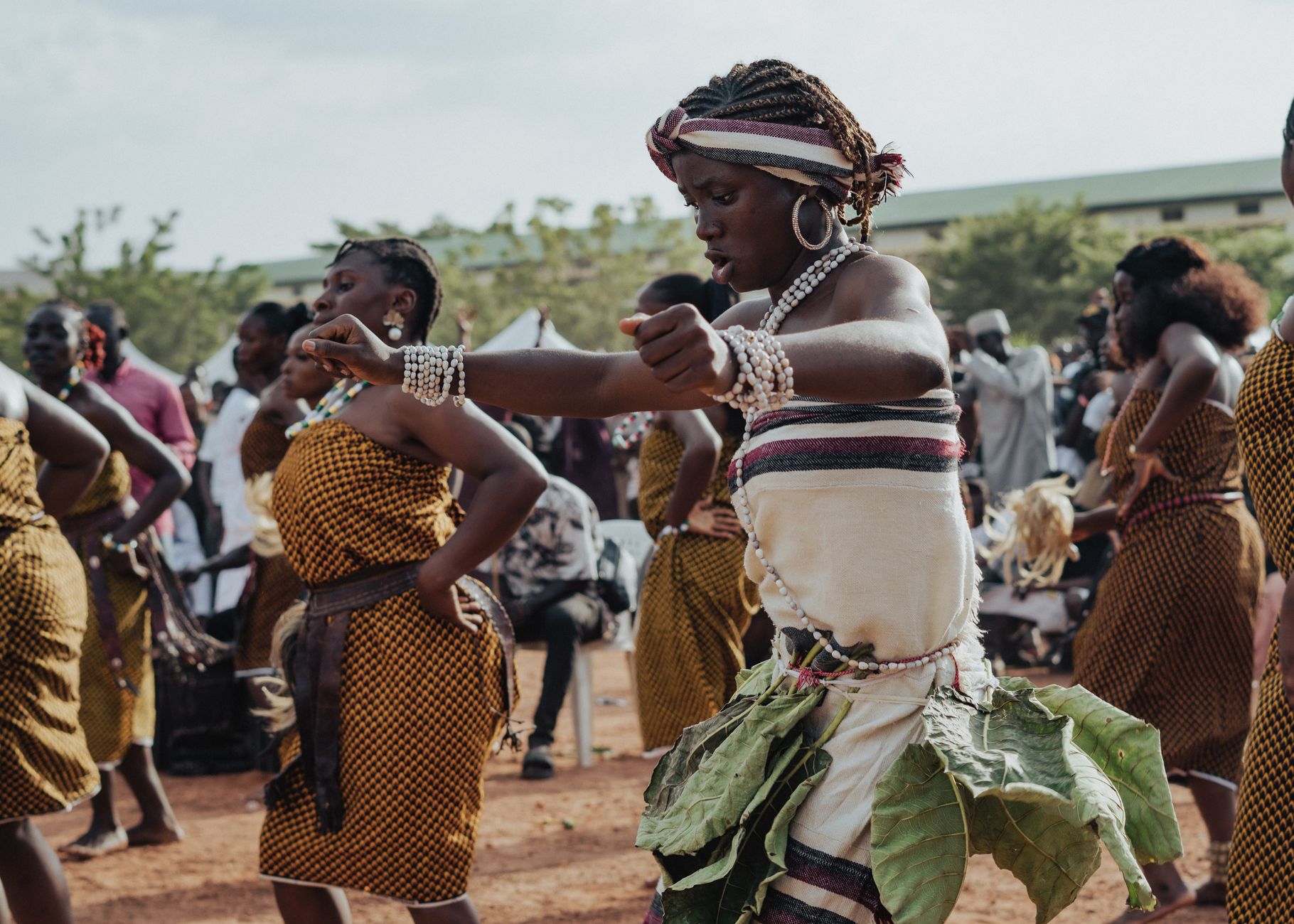 Colorful African cultural festival with traditional attire and dancing