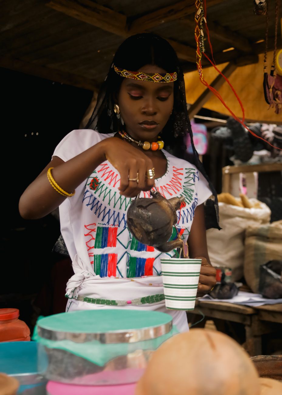Ethiopian coffee ceremony with traditional clay pot and incense