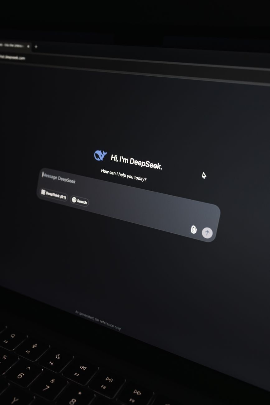 African creator using AI tools on laptop to produce digital content