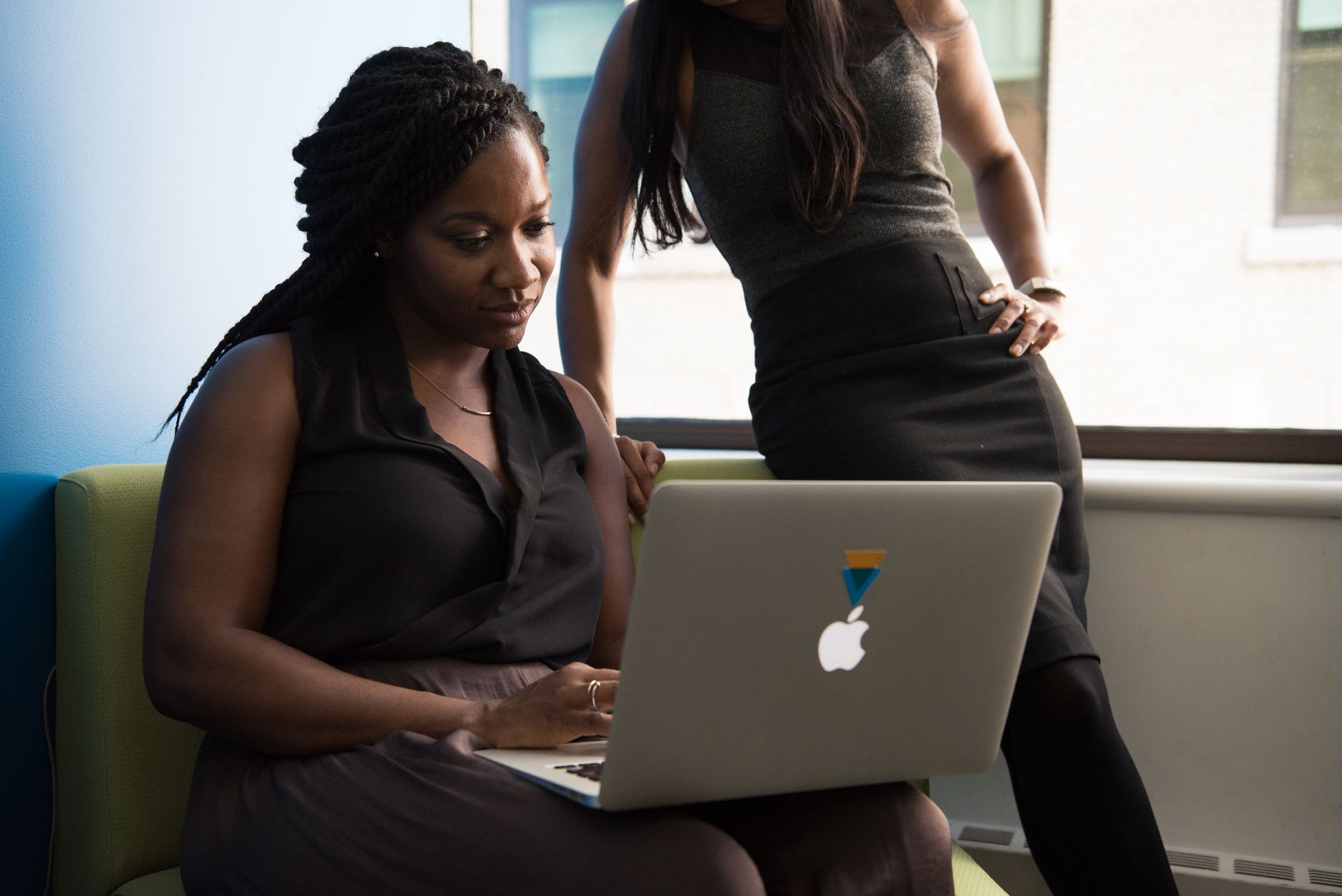 African tech entrepreneur working on a laptop in a modern co-working space