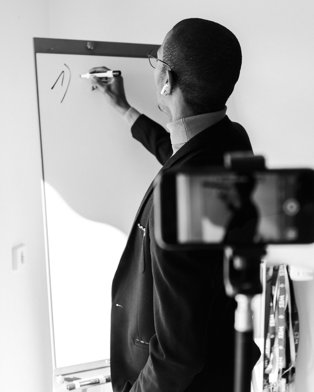 Young African creator filming a short-form educational video on a smartphone