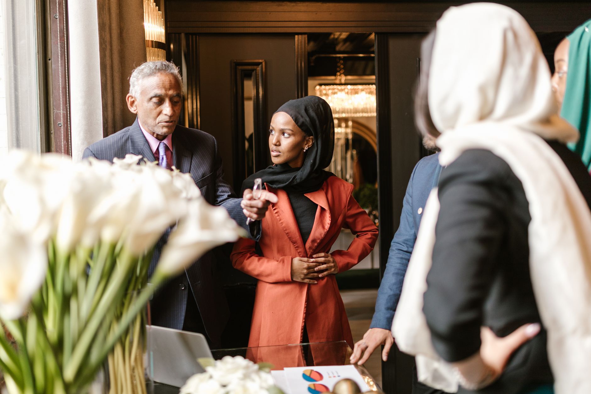 African entrepreneurs and creators networking at a conference in a modern African city