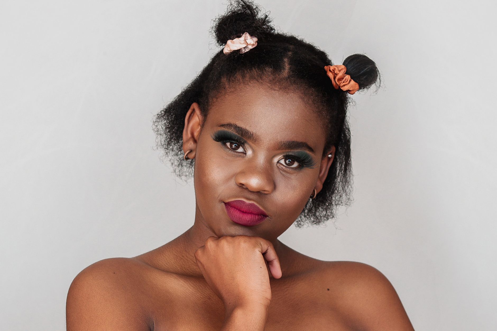 South African beauty influencer applying makeup on camera