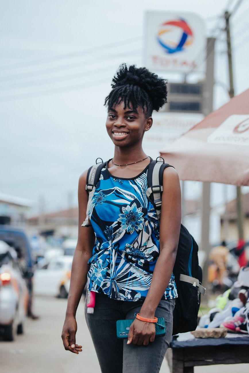Ghanaian travel vlogger filming in African city