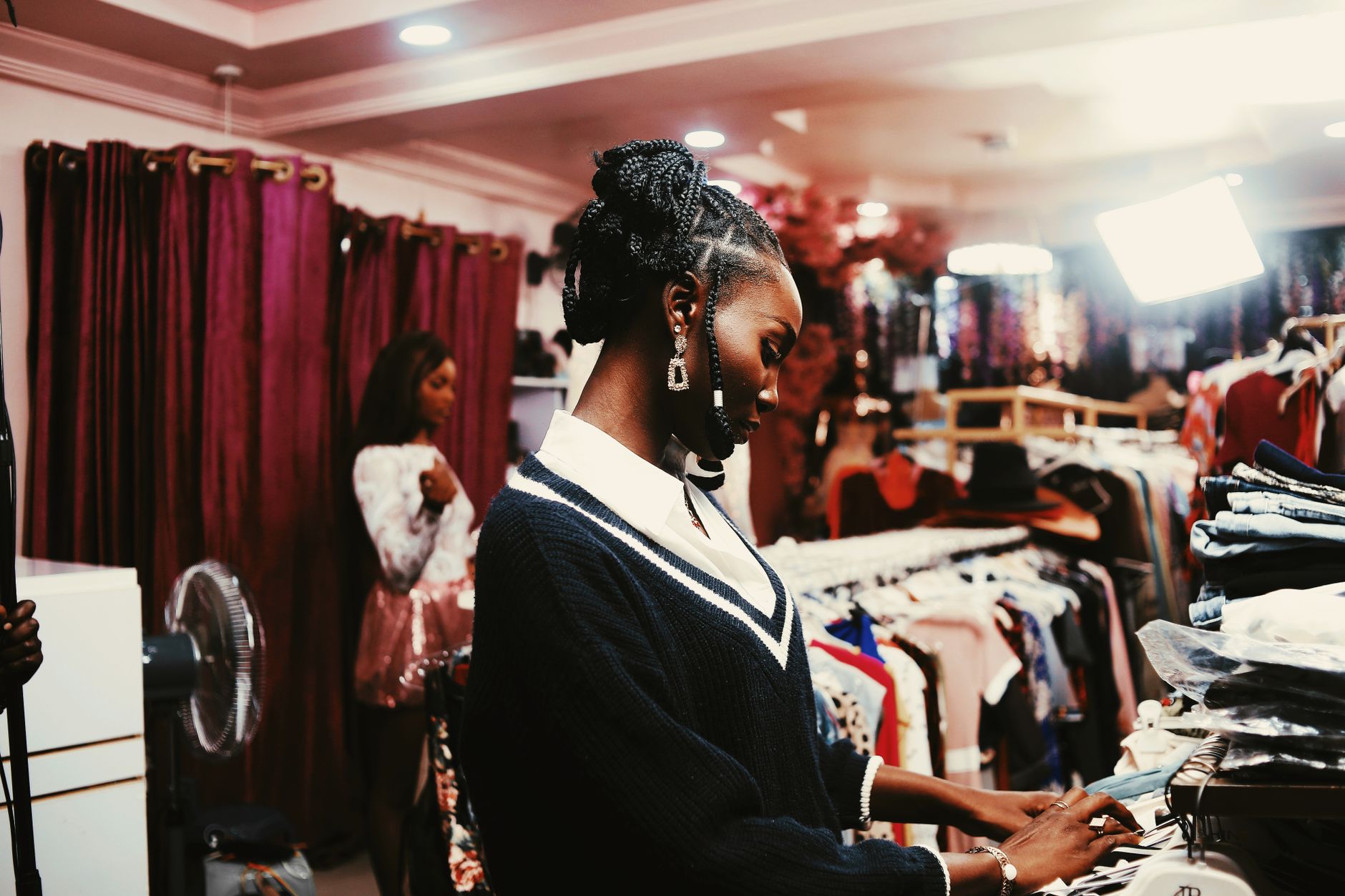 Diaspora fashion brand display in a modern retail store with African cultural motifs