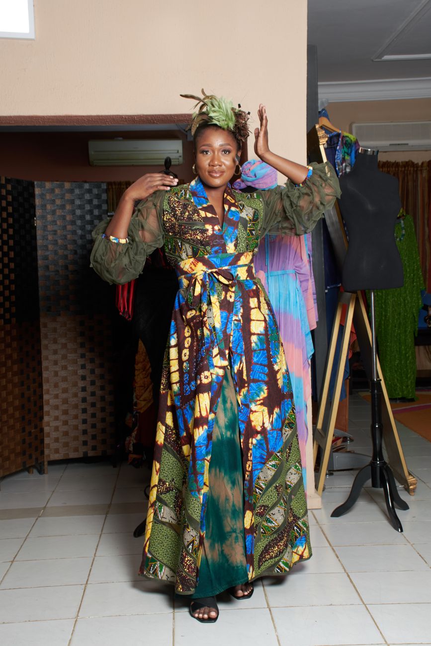 African fashion designer working on garment design in a creative studio