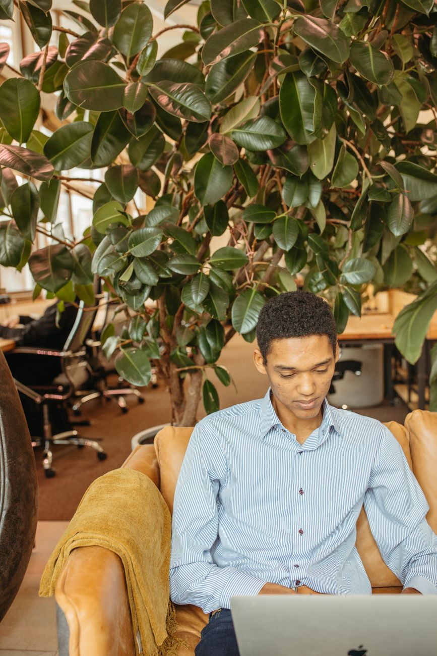 African entrepreneurs and creators collaborating on AI startup in modern co-working space