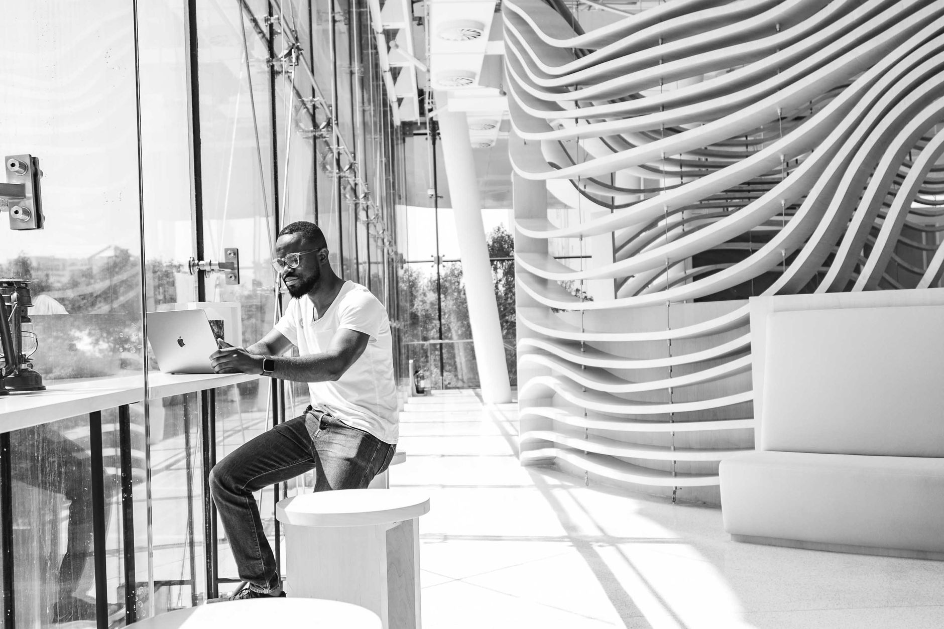 African entrepreneurs collaborating on innovation challenge applications in a modern workspace