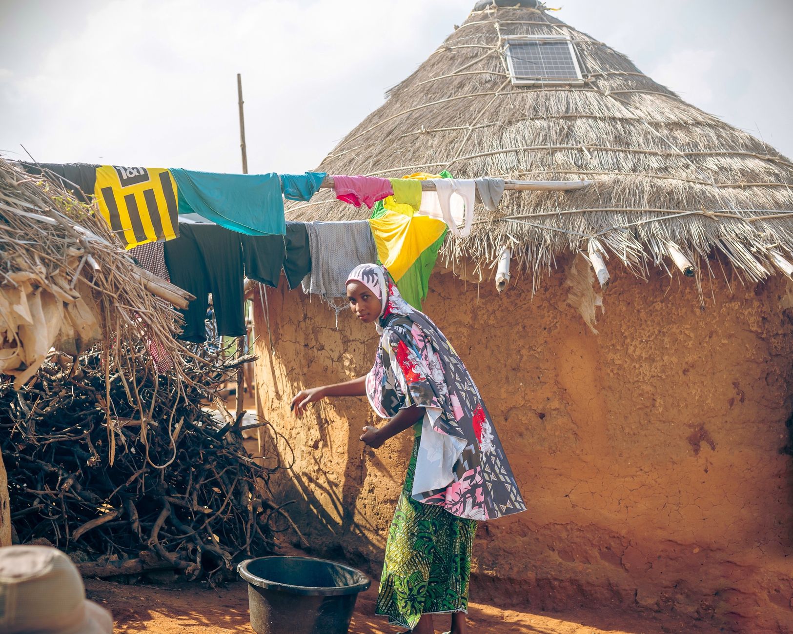 Solar energy panels in an African rural community representing clean energy innovation