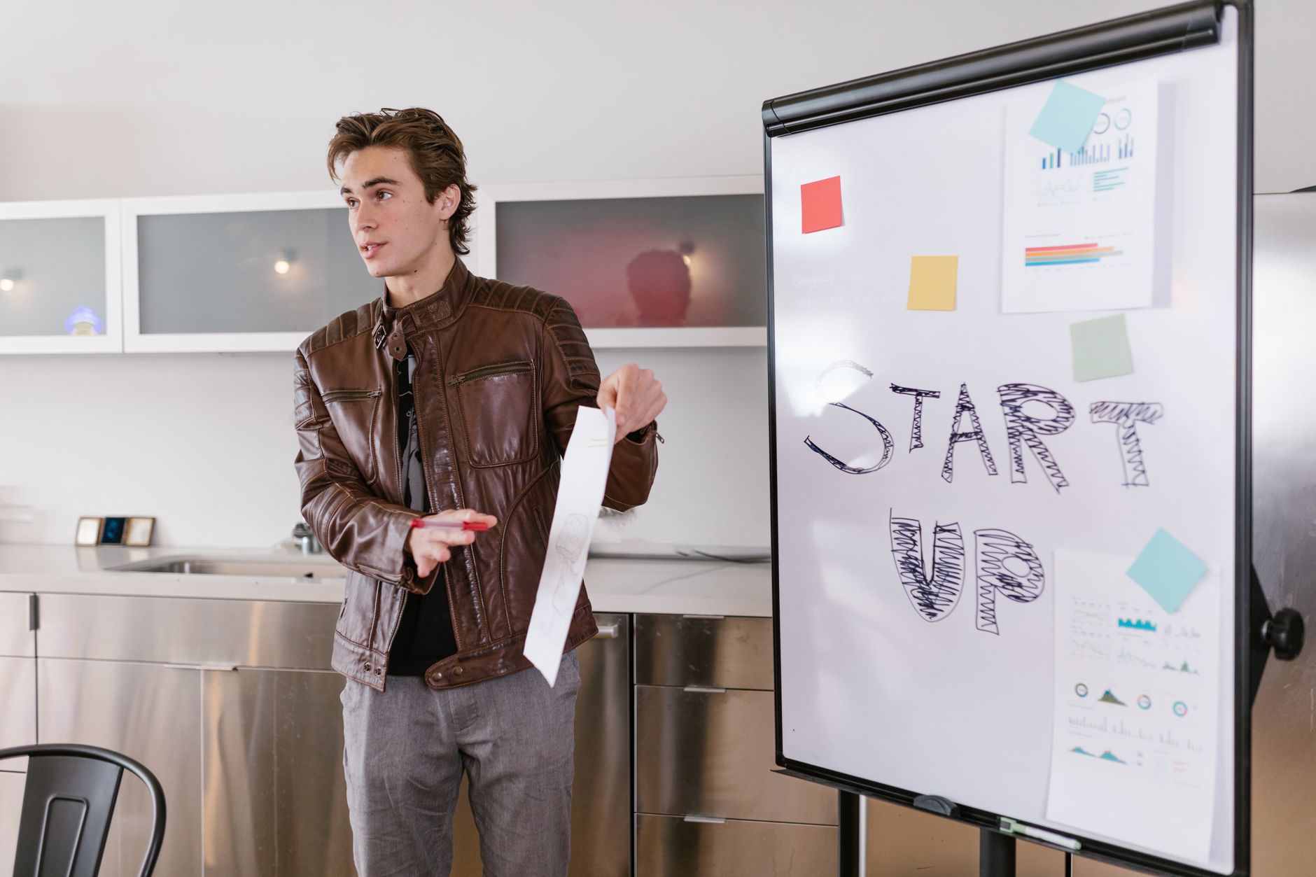 African entrepreneur presenting AI language model project at a tech conference