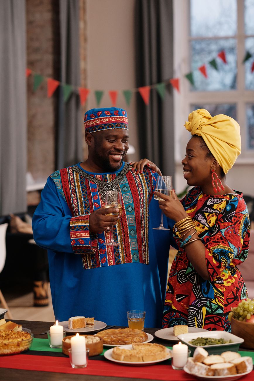 Vibrant African traditional festival attire and food spread