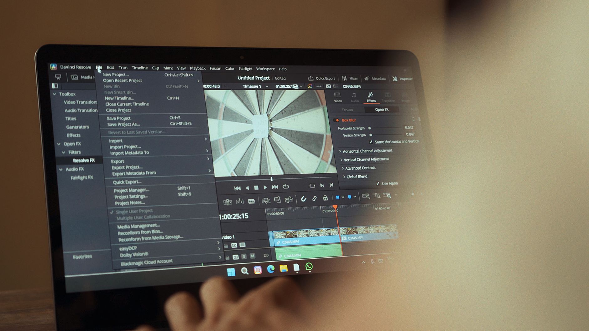 African visual storyteller editing cultural documentary on laptop