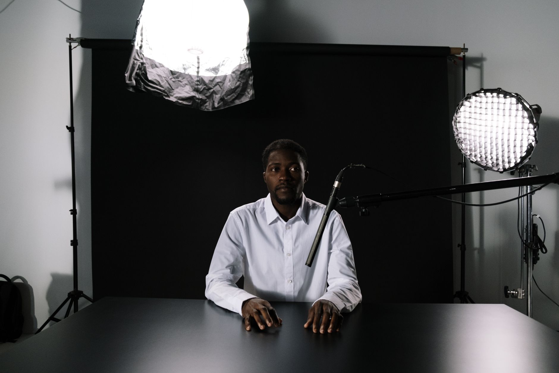 African content creator recording video in a modern studio